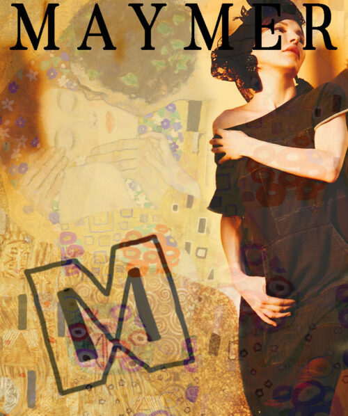 martha may looking to the right next to yellow wall and maymer logo